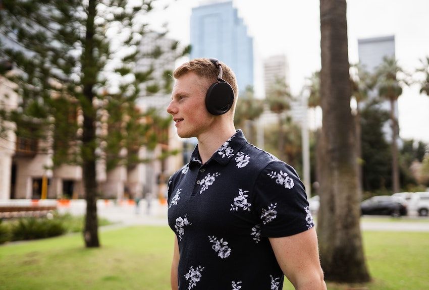 person-with-headphones-on-walking-outside.jpg
